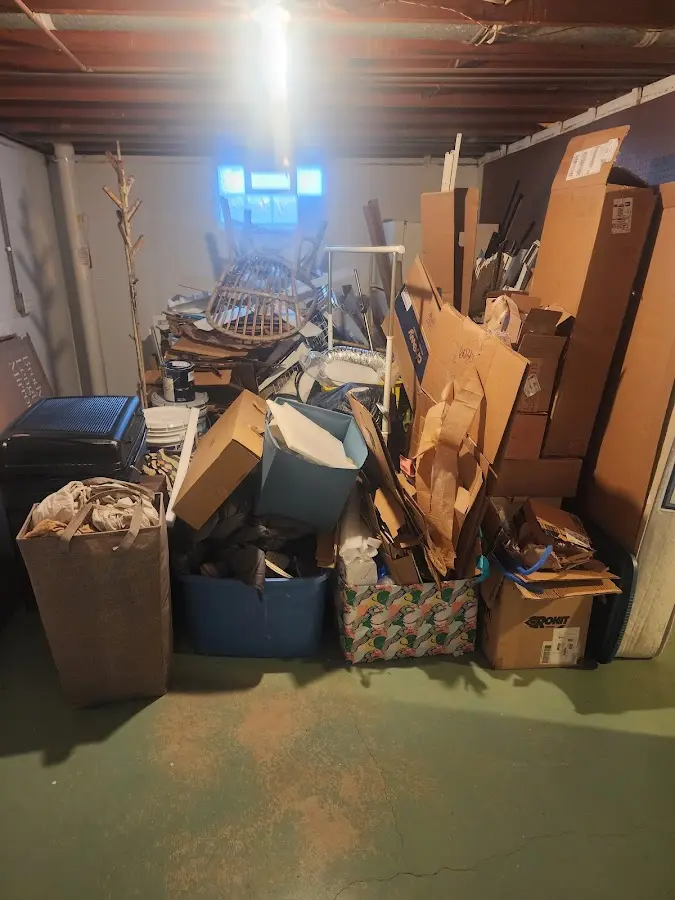 Roll-off dumpster container at job site for Cleanout Dumpster Rental in Spring